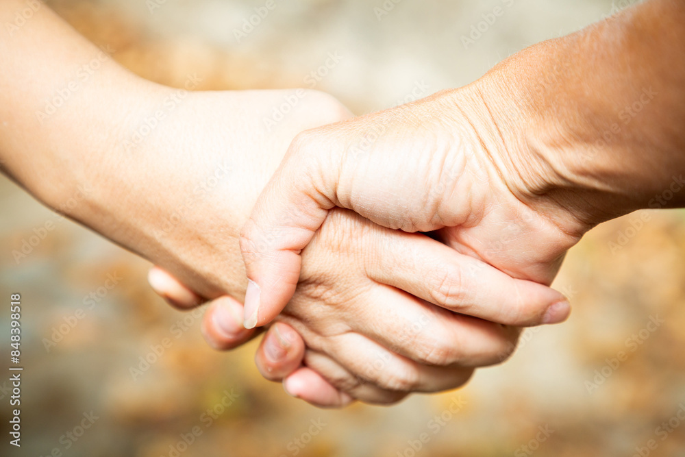 Two women shaking hands outdoors. Team work and agreement setting concept. Women solidarity and support. Caucasian palm. Strength and collaboration. fingers with blurred background. Make business Two women shaking hands outdoors. Team work and agreement setting concept. Women solidarity and support. Caucasian palm. Strength and collaboration. fingers with blurred background. Make business