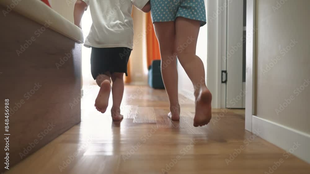 Children running indoors at home. Group friendship family kid dream concept. group of children run play around a home. Children bare feet running holding hands indoors. happy childhood fun concept. Children running indoors at home. Group friendship family kid dream concept. group of children run play around a home. Children bare feet running holding hands indoors. happy childhood fun concept.