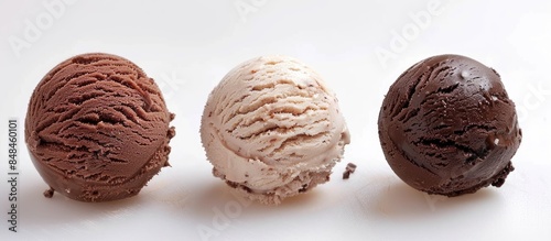Three chocolate ice cream balls in brown colors on a white background