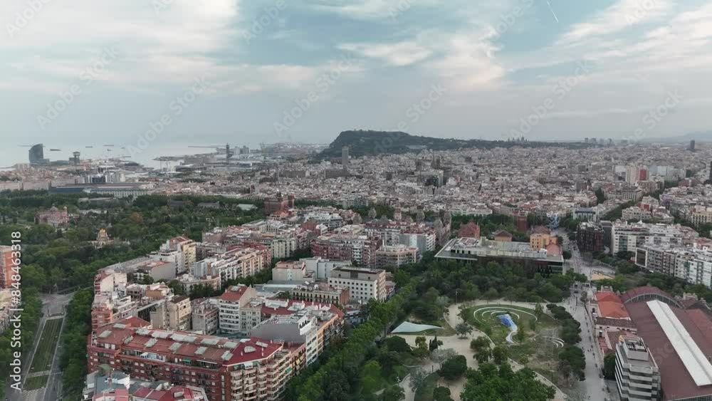 Aerial video of a residential area in Barcelona in the evening near the Arc de Triomphe