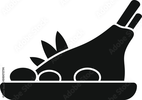 Black silhouette of a cooked turkey leg on a plate, ready to be served