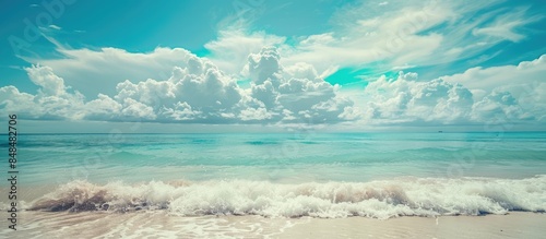 Tropical Beachscape with Clear Blue Skies and Fluffy Clouds, Perfect for Summer Getaways and Holiday Trips. Vintage Color Tones Add a Touch of Charm.