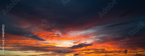 Sunrise background. Dramatic majestic scenery sunset. Sky with clouds in Sunrise sky light background. Sunrise with clouds in various shapes. Calm Sunrise sky and sun through clouds over.