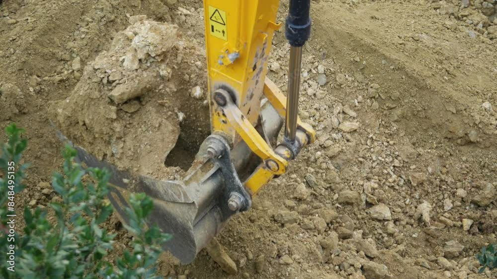Simultaneously working excavators. Two crawler excavator buckets operating for lifting soil, earthworks. 4k. Use the shortest lifting distance possible during picking or carrying