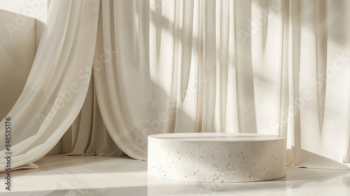 Empty modern round cream side table on a terrazzo podium with light sheer curtains in the background, for cosmetics or skincare products. Sunlight and foliage leave shadows on the wall. Background.