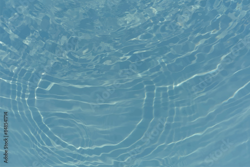 Blue water with ripples on the surface. Defocus blurred transparent blue colored clear calm water surface texture with splashes and bubbles. Water waves with shining pattern texture background.