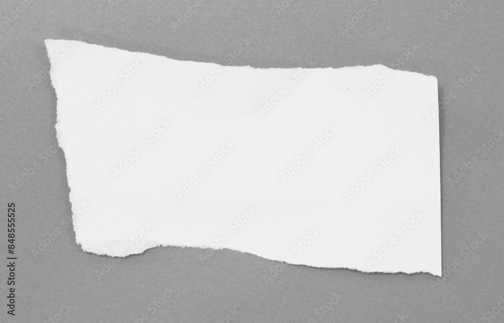 Ripped paper on grey background, space for advertising copy. Ripped paper on grey background, space for advertising copy.