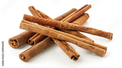 Brown Cinnamomum verum sticks with appetizing close up isolated on white background photo
