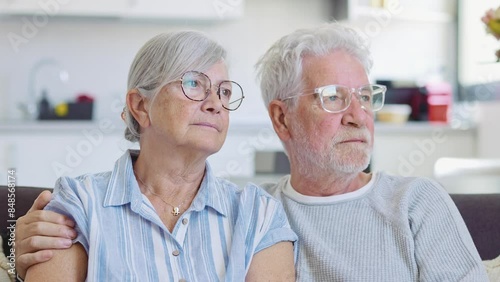 Wallpaper Mural Pensive elderly mature senior man in eyeglasses looking in distance out of window, thinking of personal problems. Old woman wife consoling and hugging sad husband, copy space
 Torontodigital.ca