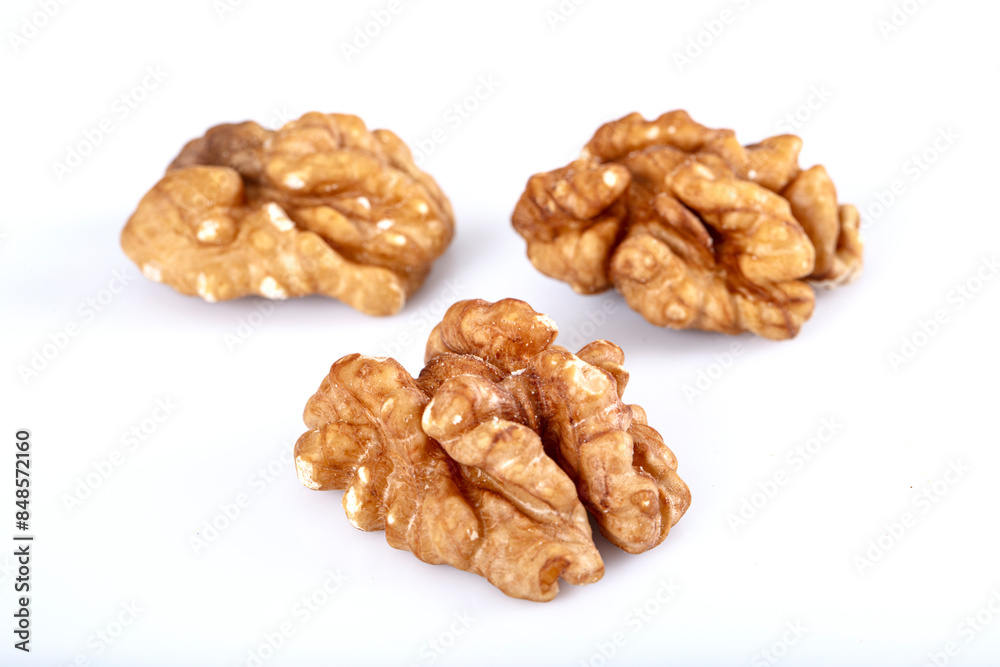 Walnut kernel, Closeup of big shelled walnuts pile. Top view of bunch of nutrient fresh walnuts without shell isolated on white background. Walnut kernel, Closeup of big shelled walnuts pile. Top view of bunch of nutrient fresh walnuts without shell isolated on white background.