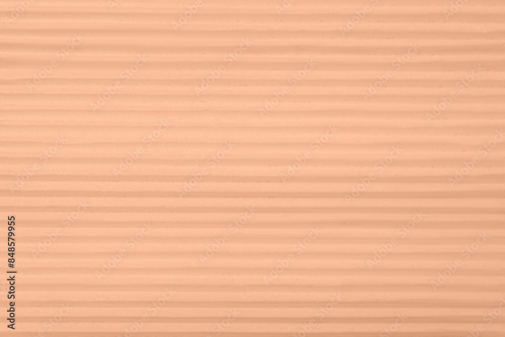 Fototapeta premium Peach fuzz color textured surface, closeup. Trendy shade of 2024 year