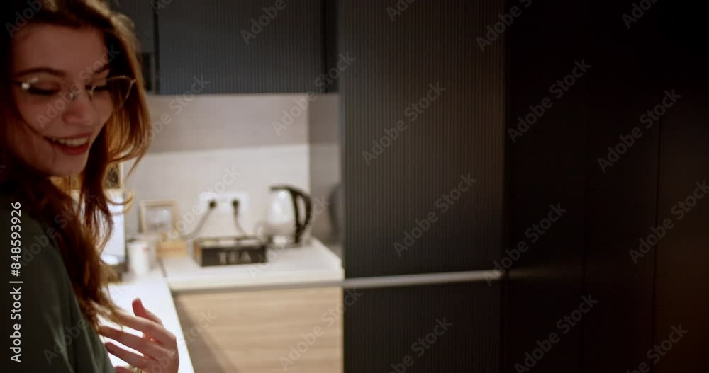 Two colleagues taking a break and chatting in a stylish company kitchen, fostering camaraderie and comfort at the workplace. Two colleagues taking a break and chatting in a stylish company kitchen, fostering camaraderie and comfort at the workplace.