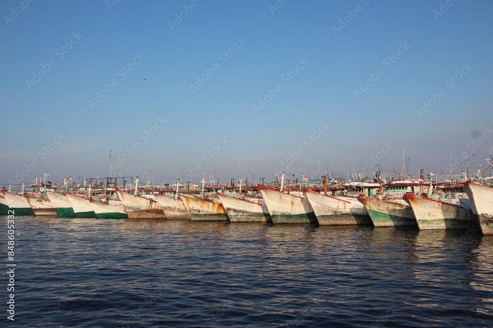 Many fishing boats are anchored at Nizam Zachman port, Jakarta, Indonesia. Many fishing boats are anchored at Nizam Zachman port, Jakarta, Indonesia.