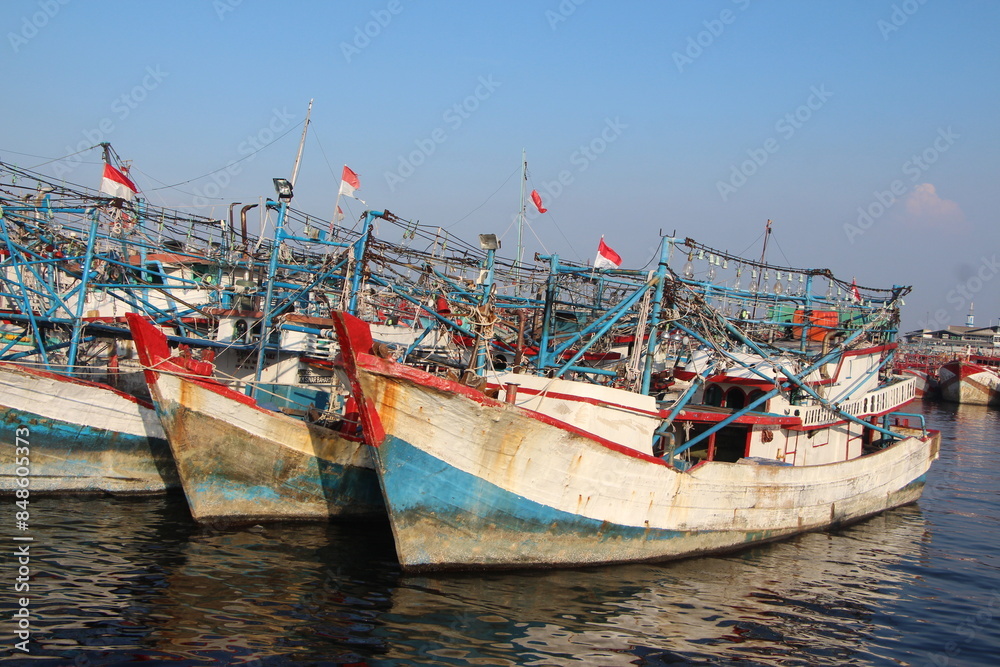Many fishing boats are anchored at Nizam Zachman port, Jakarta, Indonesia. Many fishing boats are anchored at Nizam Zachman port, Jakarta, Indonesia.