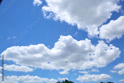 Fototapeta Naklejka Na Ścianę i Meble -  Bright blue sky with soft fluffy clouds.