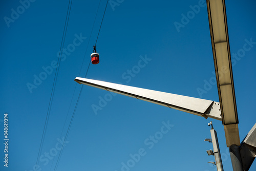Red cable car against deep blue skies