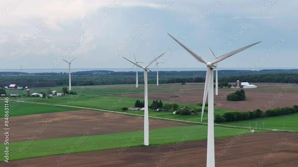 Wind Turbines in Northeast Wisconsin turn in the wind producing electricity. Wind Turbines in Northeast Wisconsin turn in the wind producing electricity.