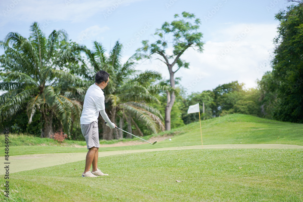Asian man enjoy playing golf. Asian man enjoy playing golf.
