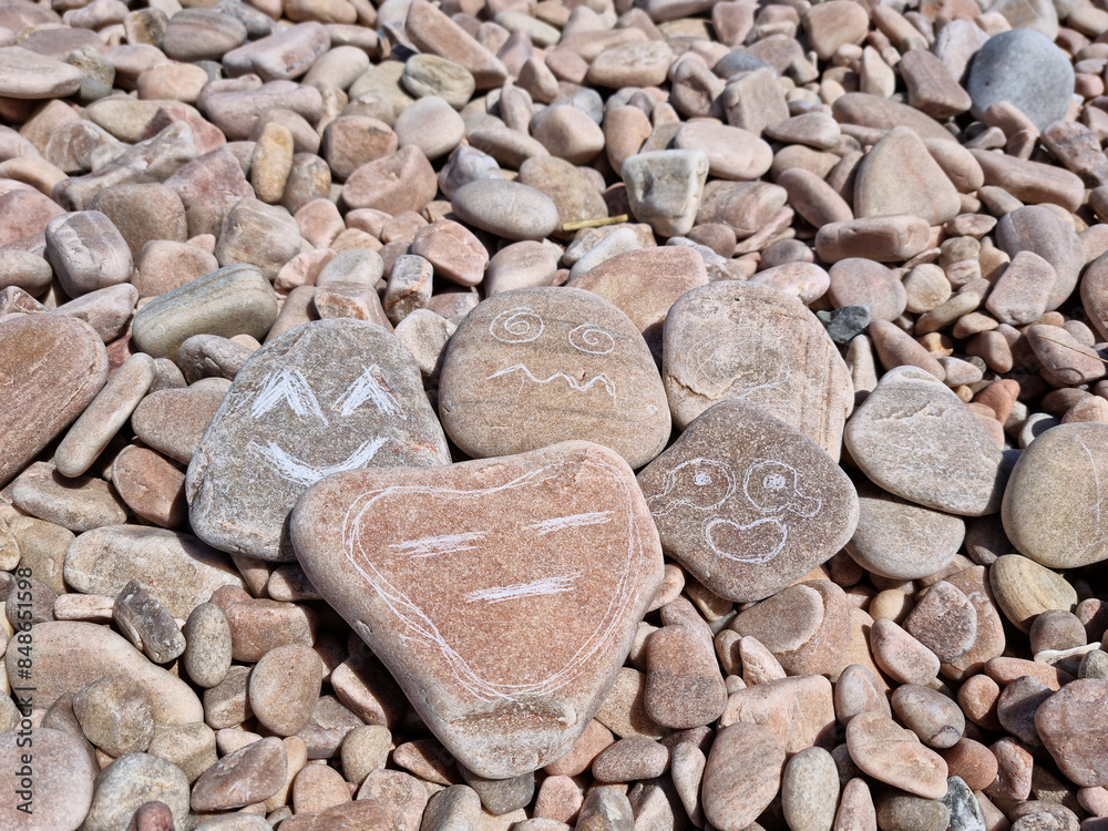 Various facial expressions drawn on pebbles
Various facial expressions drawn on pebbles