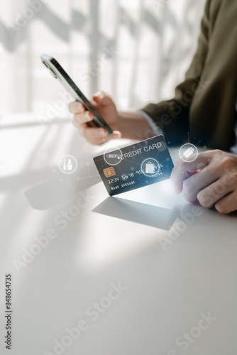 Online shopping and credit card payment concept, person is shopping on an online shopping website, purchasing goods and services securely, debiting credit card to pay for goods on the internet.
