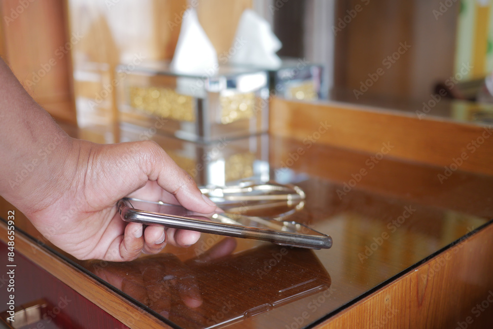 man hand picking up smart phone mobile to receive a call man hand picking up smart phone mobile to receive a call
