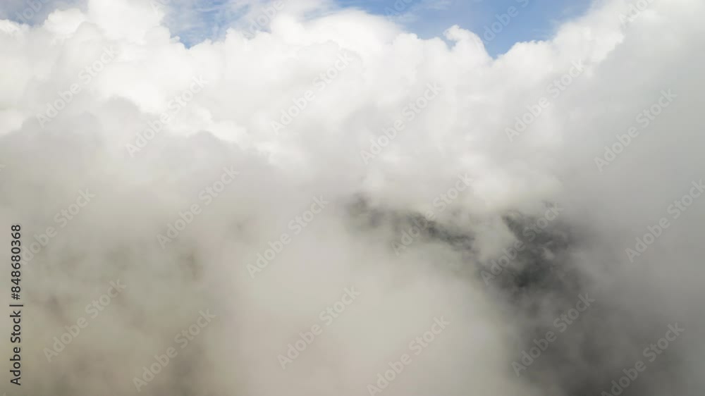 Soothing serene natural background of clouds over forest, aerial drone establishing Soothing serene natural background of clouds over forest, aerial drone establishing