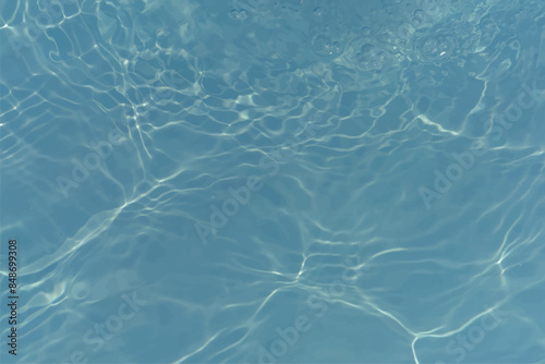 Blue water with ripples on the surface. Defocus blurred transparent blue colored clear calm water surface texture with splashes and bubbles. Water waves with shining pattern texture background.