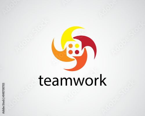 creative four people gathered together holding hands in a circle shaped like a rotating propeller logo
