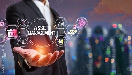 Asset Management  Businessman Hand Holding Asset Management Icon with Technological Icons. Financial Insights and Strategic Planning, Risk Assessment and Portfolio Optimizations