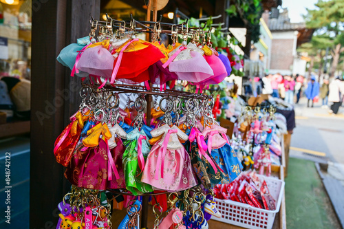 Seoul, South Korea - NOV 03, 2023: Street vendors selling Korean souvenirs at Bukchon Hanok Village.