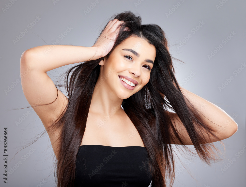 Woman, hair care and portrait in studio with smile, salon and keratin treatment for growth or beauty with natural makeup. Cosmetology, health and skincare with female person, wind and happiness Woman, hair care and portrait in studio with smile, salon and keratin treatment for growth or beauty with natural makeup. Cosmetology, health and skincare with female person, wind and happiness