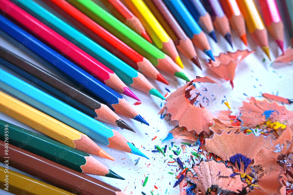 A diagonal arrangement of sharpened colored pencils with the tips facing the viewer. A diagonal arrangement of sharpened colored pencils with the tips facing the viewer.