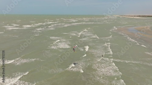 Kitesurfer cruising and jumping on the ocean near Jericoacoara.