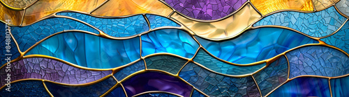 Abstract background with a stained glass pattern in blue, purple and yellow colors. Wavy mosaic lines of colored glass for decoration on the wall and as interior design texture.