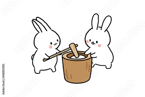 餅つきをする二匹のかわいいうさぎ
