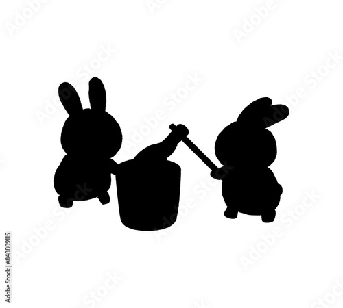 餅つきをする二匹のうさぎのシルエット
