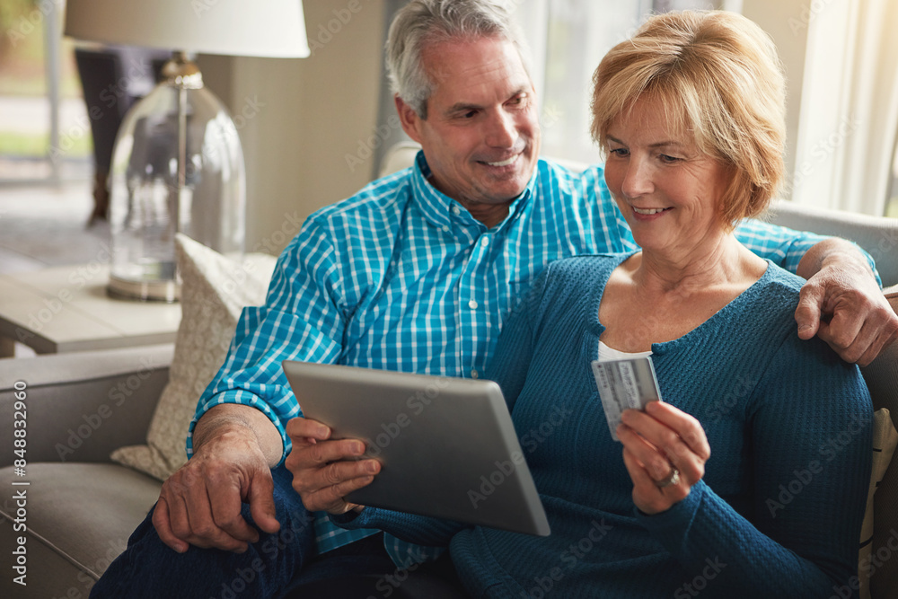 Senior couple, tablet and credit card in home for e commerce, decision and sale on web on living room sofa. Old man, woman and fintech app for banking with deal, discount and smile on couch in house Senior couple, tablet and credit card in home for e commerce, decision and sale on web on living room sofa. Old man, woman and fintech app for banking with deal, discount and smile on couch in house