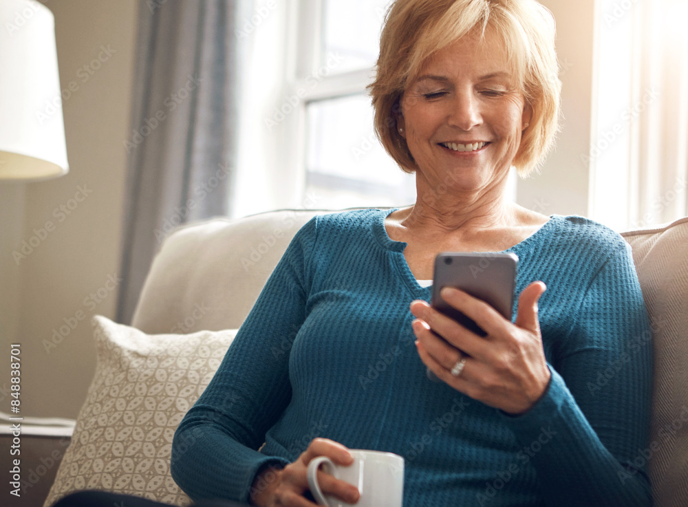 Home, relax and old woman on sofa with smartphone, typing and connection with reading in living room. Senior person, apartment or mature lady with cellphone, internet and digital app with coffee Home, relax and old woman on sofa with smartphone, typing and connection with reading in living room. Senior person, apartment or mature lady with cellphone, internet and digital app with coffee