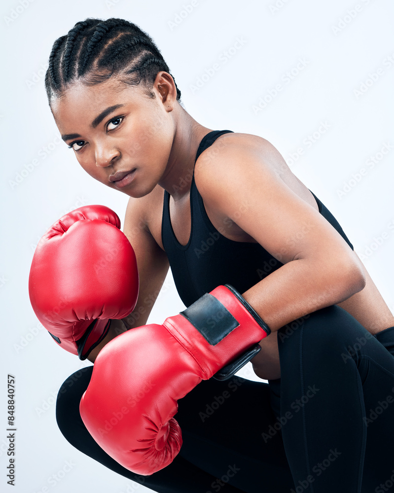 Black girl, portrait and boxing gloves for exercise in studio, serious and fight on white background. Female person, warrior and martial arts practice or challenge, training and fitness for battle Black girl, portrait and boxing gloves for exercise in studio, serious and fight on white background. Female person, warrior and martial arts practice or challenge, training and fitness for battle