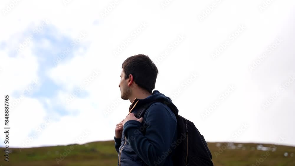 Hiker enjoying the view in the Welsh countryside in Brecon Beacons National Park Hiker enjoying the view in the Welsh countryside in Brecon Beacons National Park