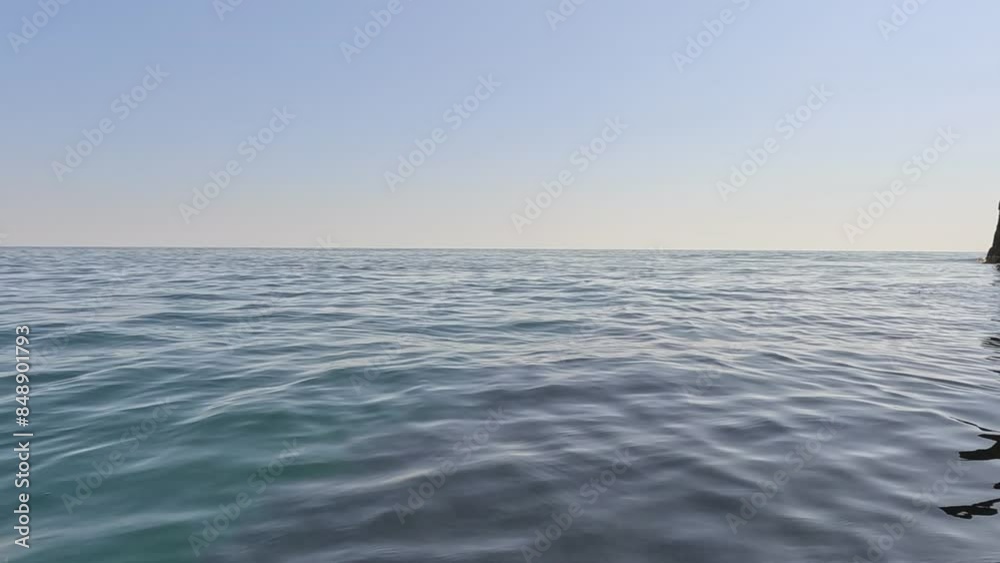 Aerial view on calm azure sea and volcanic rocky shores. Small waves on water surface. Nature summer ocean sea beach view. Nobody. Holiday, vacation and travel concept. Weather and climate change Aerial view on calm azure sea and volcanic rocky shores. Small waves on water surface. Nature summer ocean sea beach view. Nobody. Holiday, vacation and travel concept. Weather and climate change