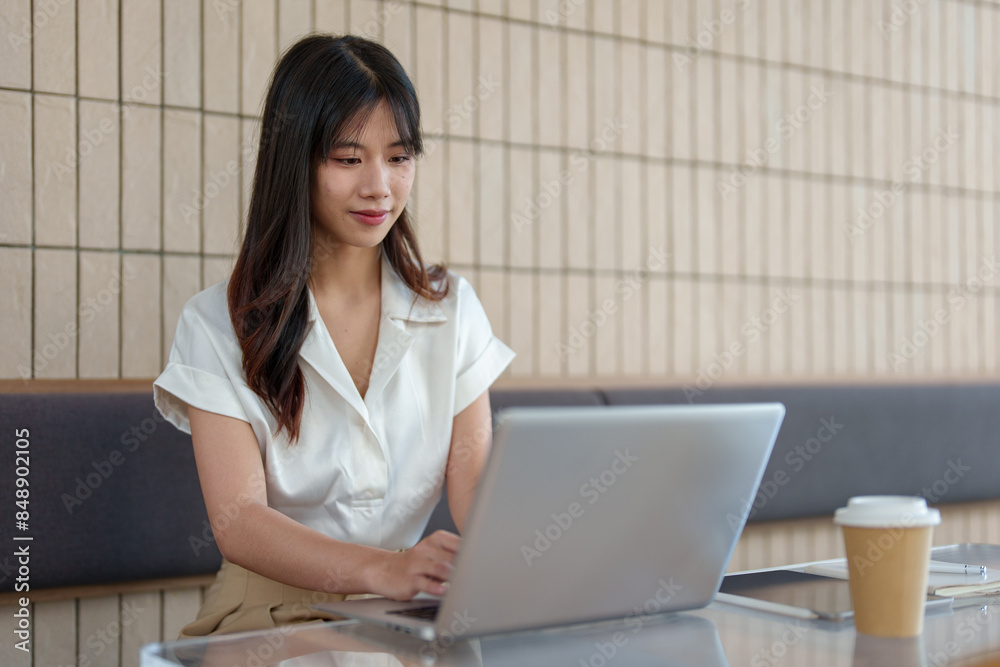 Woman working outside using laptop Tablet for work learning. Attentive Asian woman checks taxes, rent, financial expenses to control finances online. Work concept, accounting, working on holidays. Woman working outside using laptop Tablet for work learning. Attentive Asian woman checks taxes, rent, financial expenses to control finances online. Work concept, accounting, working on holidays.