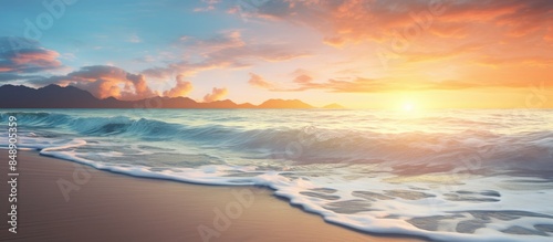 A scenic sunrise on the coast with the ocean shore bathed in the soft morning sunlight creating a beautiful landscape with a serene copy space image