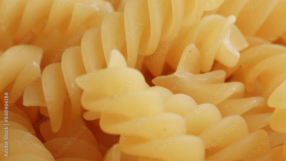 Fusilli pasta fresh extreme close up with a rotating camera move stock footage Fusilli pasta fresh extreme close up with a rotating camera move stock footage