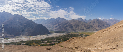 Panoramic landscape view on Wakhan Corridor overlooking Panj river valley and Hindu Kush mountain range in Afghanistan, Langar, Gorno-Badakhshan, Tajikistan photo