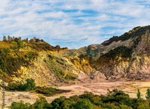 landscape of Plegrean volcano fields in Naples Italy near Pompeii with sulfur yellow caldera duribg eruption of smoke. campi Flegrei and cataclysm of Earthquake photo