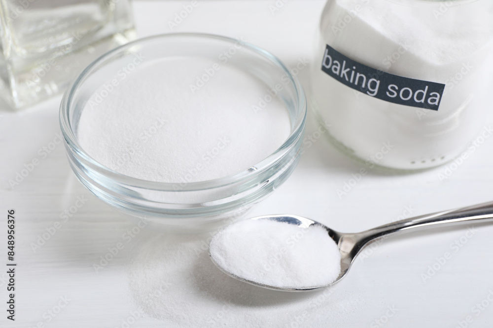 Baking soda on white wooden table, closeup Baking soda on white wooden table, closeup