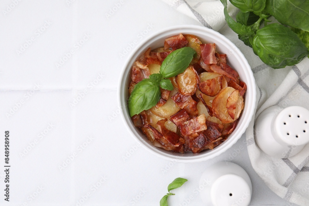 Delicious baked potatoes, bacon and basil on white table, top view. Space for text Delicious baked potatoes, bacon and basil on white table, top view. Space for text