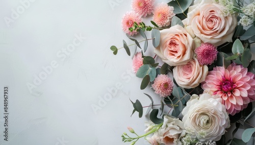 A bouquet of flowers with pink and white flowers and a green leaf. The flowers are arranged in a way that they are not overlapping each other