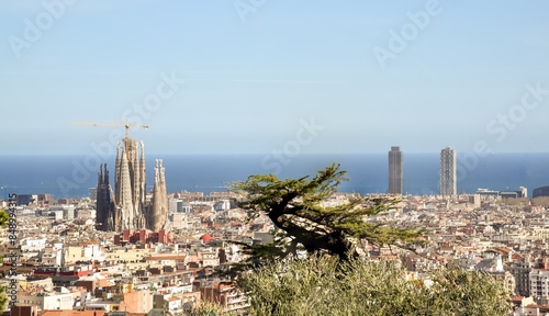panoramic view of Barcelona with the Sagrada familiar and the Mediterranean sea
